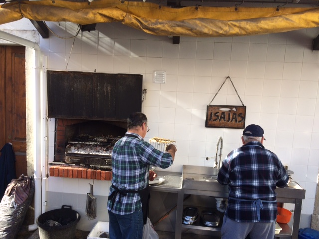 The built in grill with the owners grilling fresh fish.