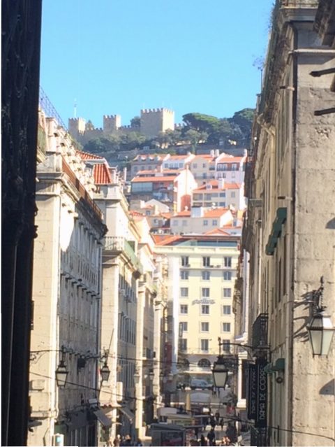 A street in Lisbon, looking towards the castle.